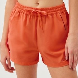 Outdoor Voices Doing Things nylon running shorts in orange red
